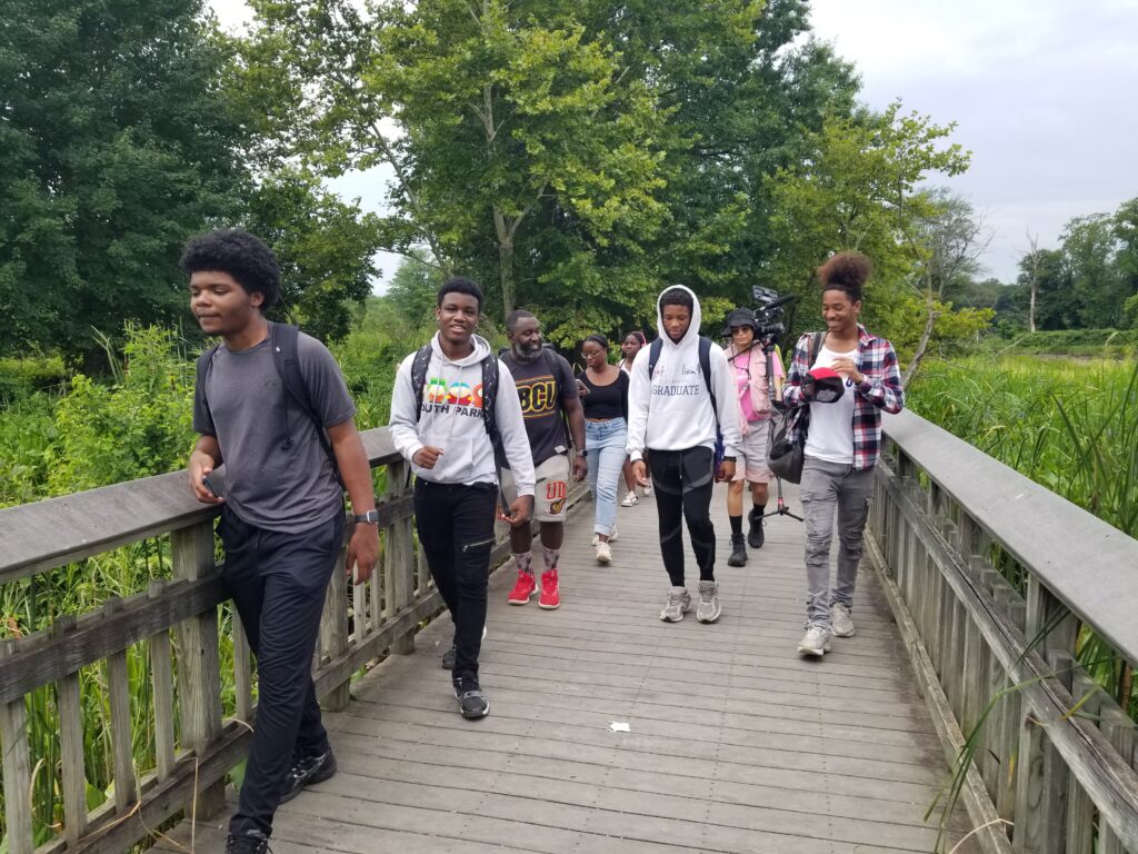 Students on a boardwalk at Kenilworth Aquatic Gardens during a Nature-Wise session